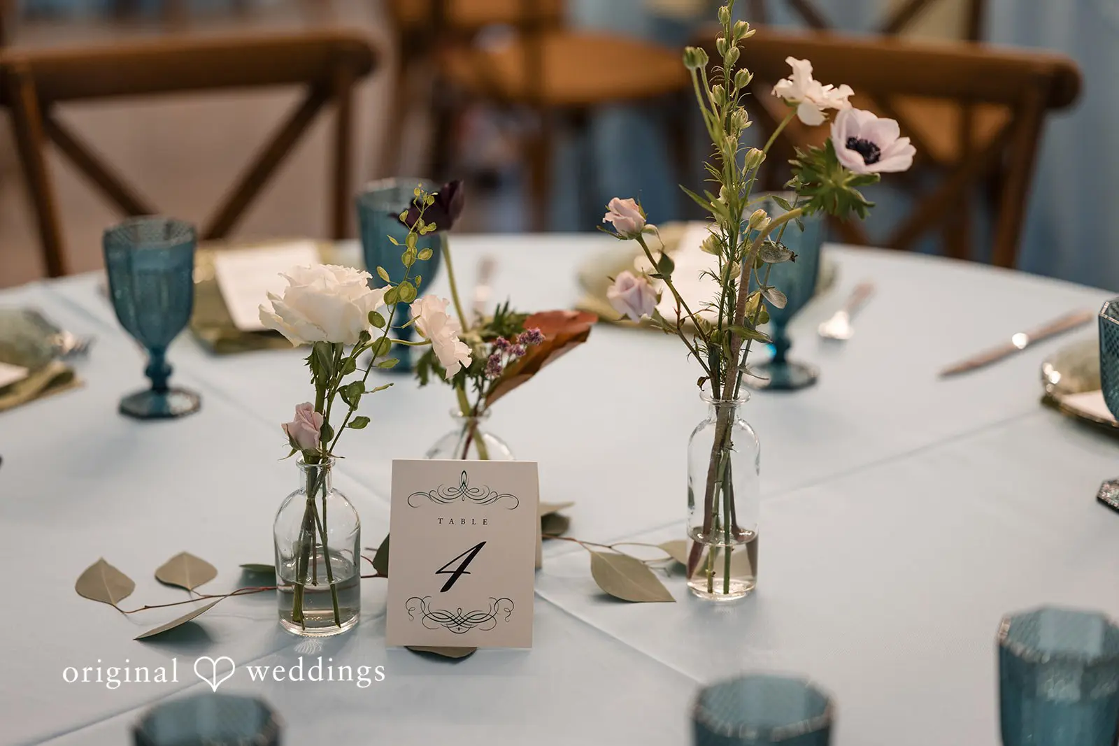 Ashley + David A detail shot of the decorated tables at the Hummingbird House wedding reception