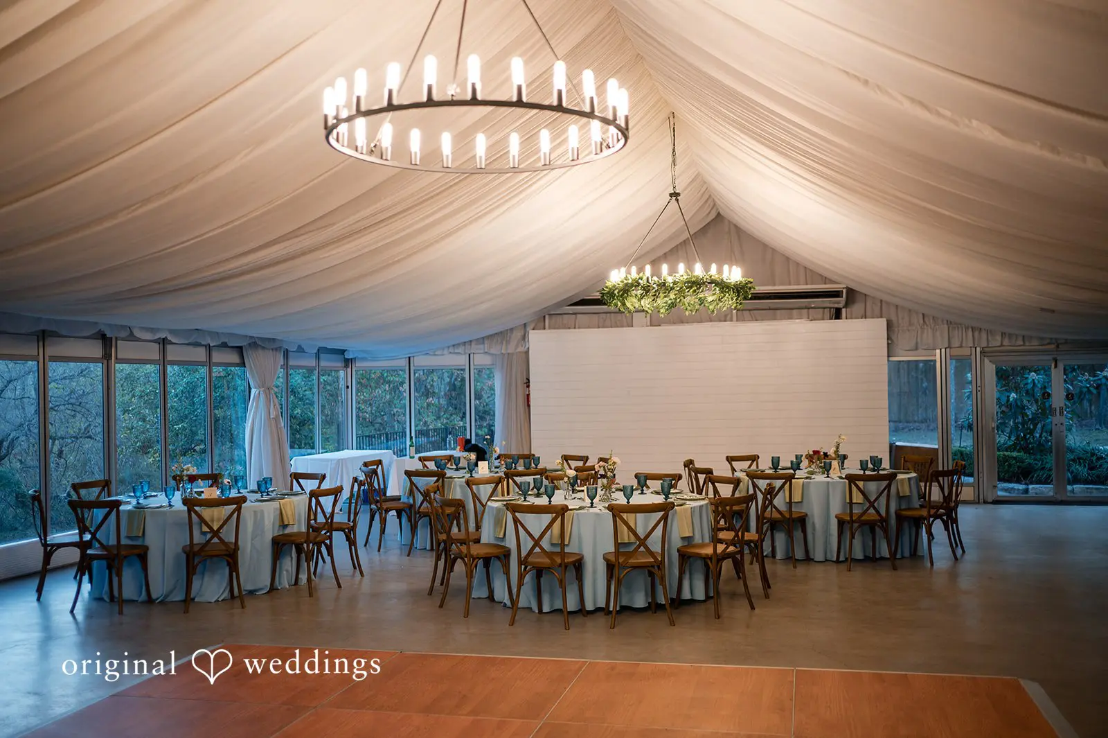 Ashley + David The tented reception space and decorated tables at Hummingbird House