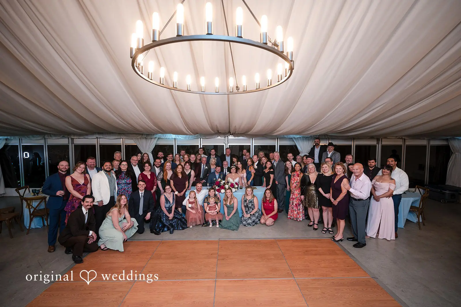 Ashley + David A portrait of the couple and their wedding party at Hummingbird House