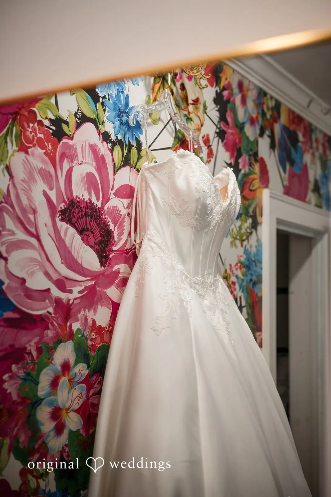 Ashley + David Bride's gown gracefully hanging at the Hummingbird House