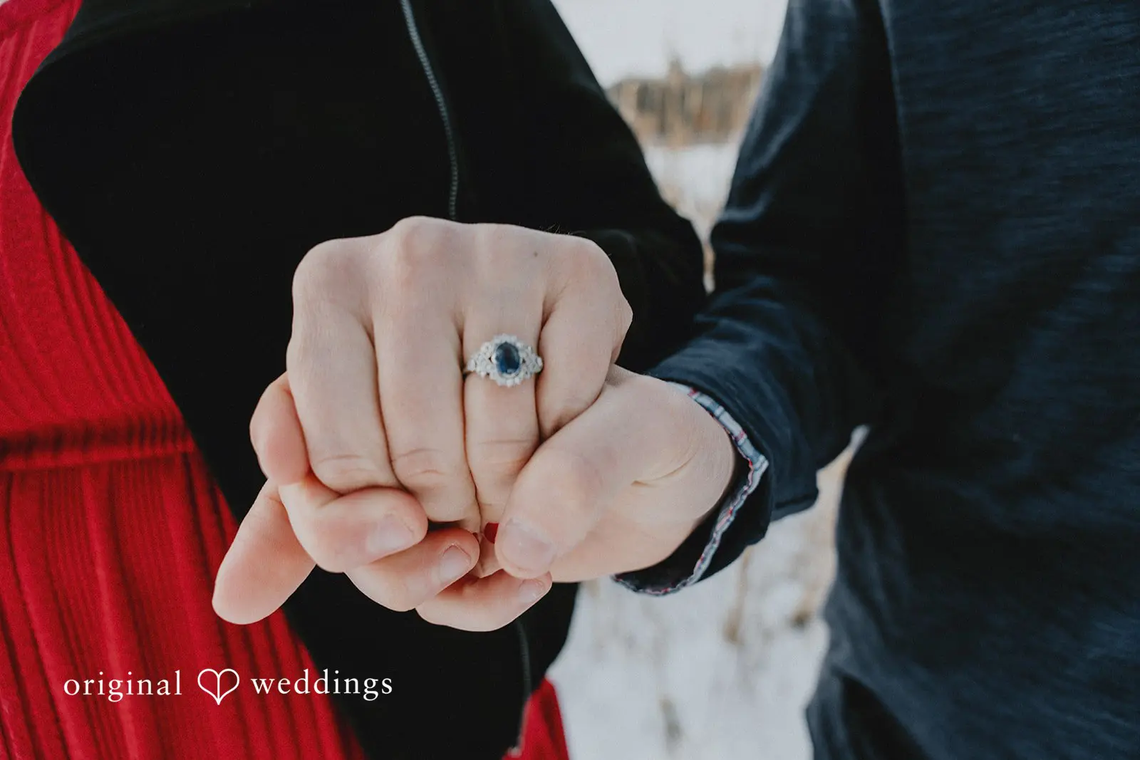 A close-up shot of the couple's hands
