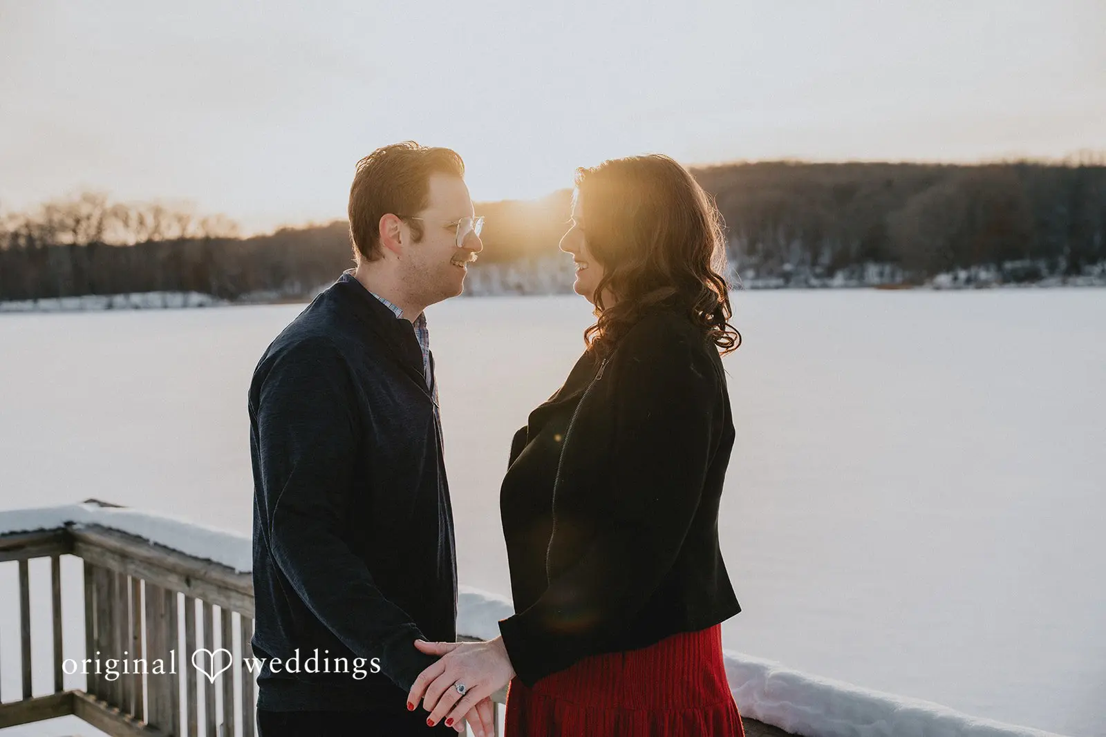 A romantic portrait of the couple with the sun adding a soft glow