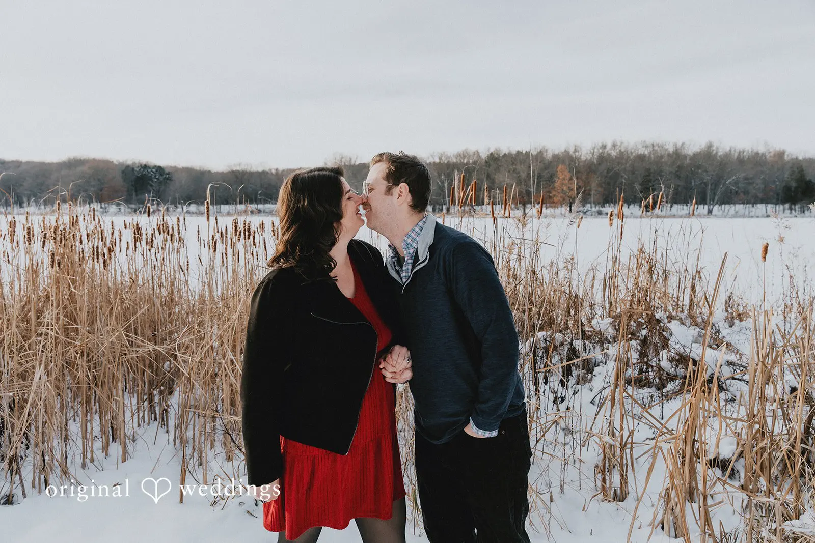 The couple shares a kiss at Independence Oaks County Park