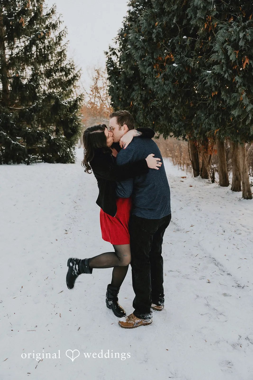 The couple shares a kiss at Independence Oaks