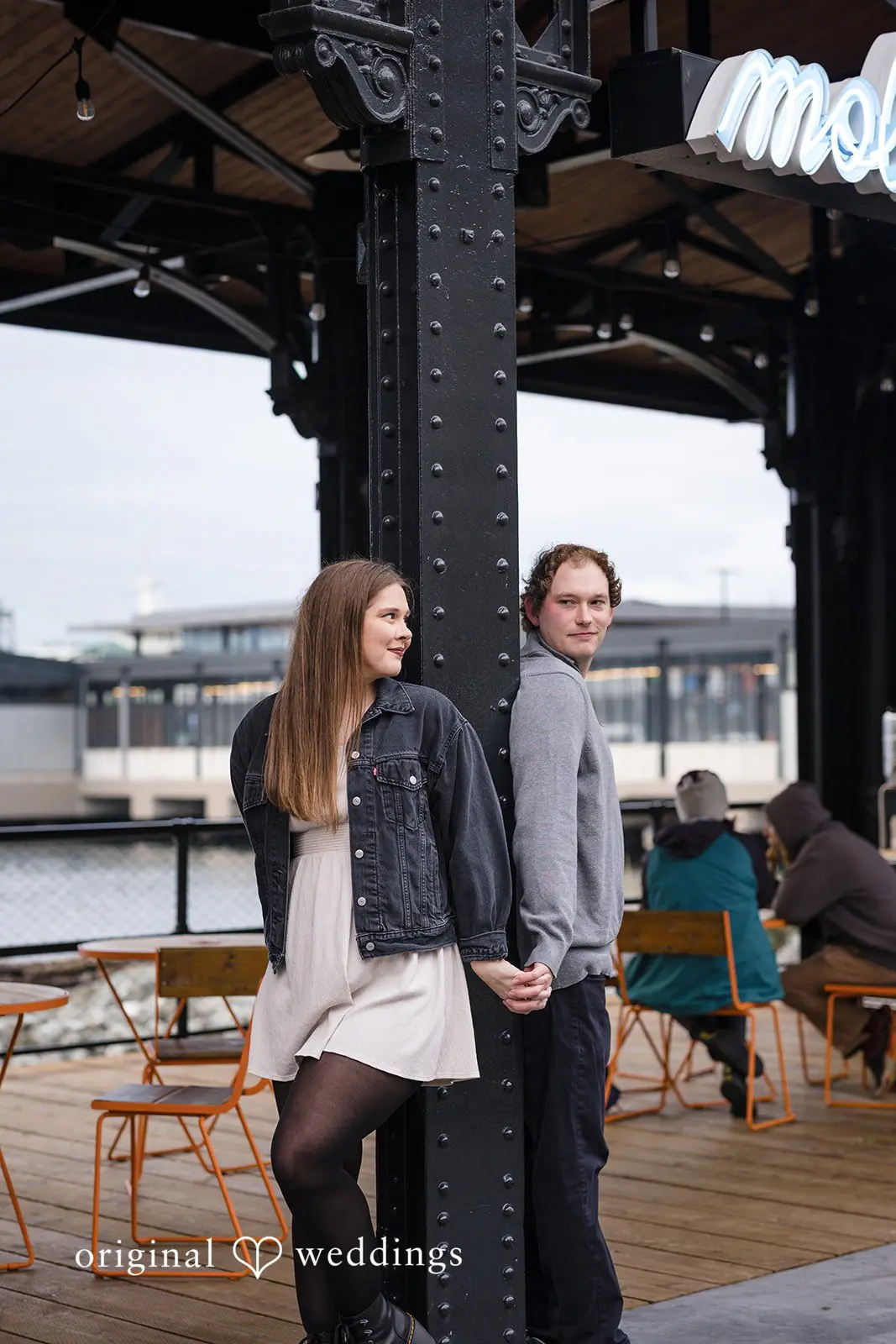 Our Seattle wedding photographer took a beautiful shot of the couple on the dock