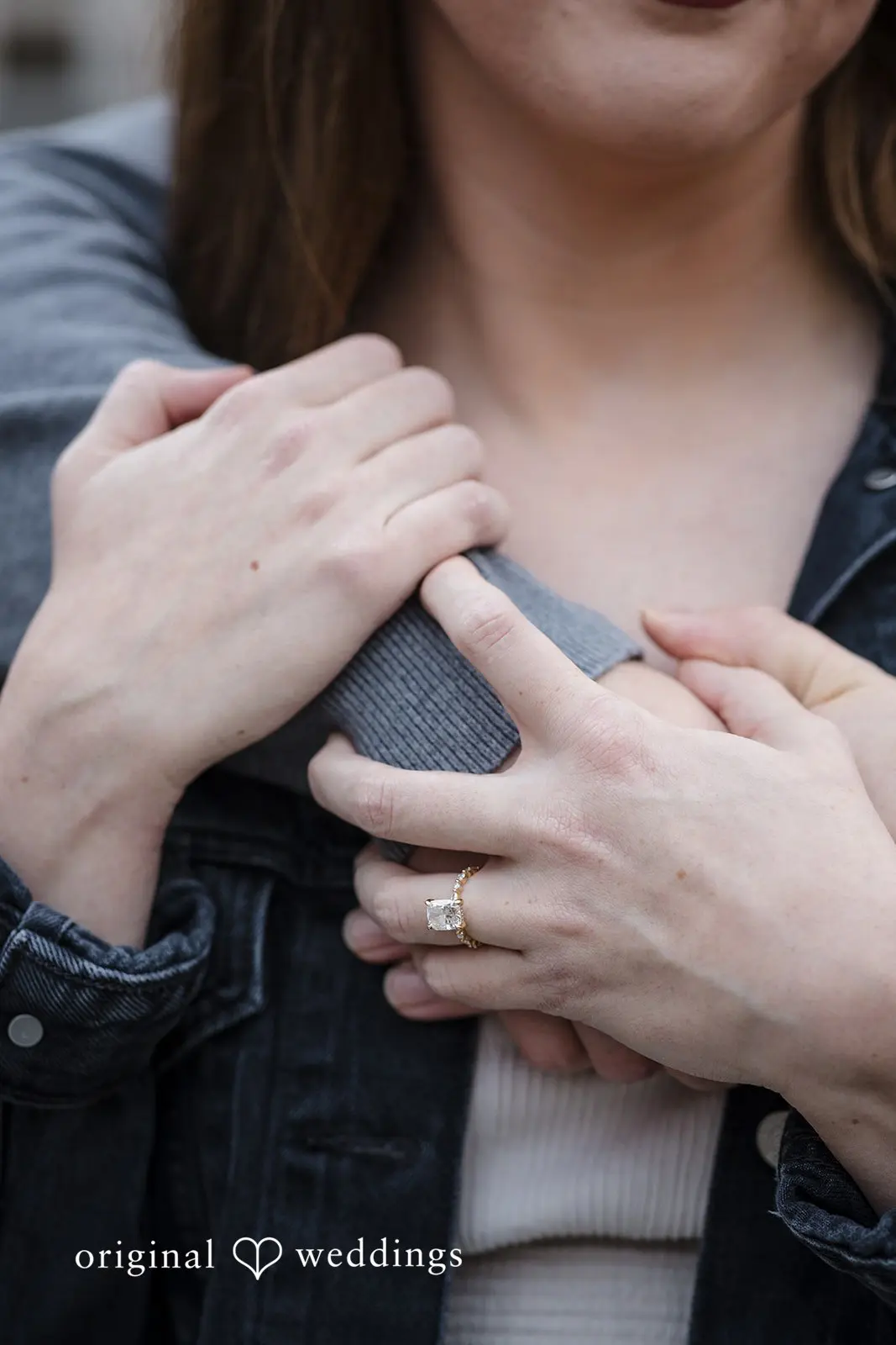 A close shot of the couple holding each other at Old Town Issaquah