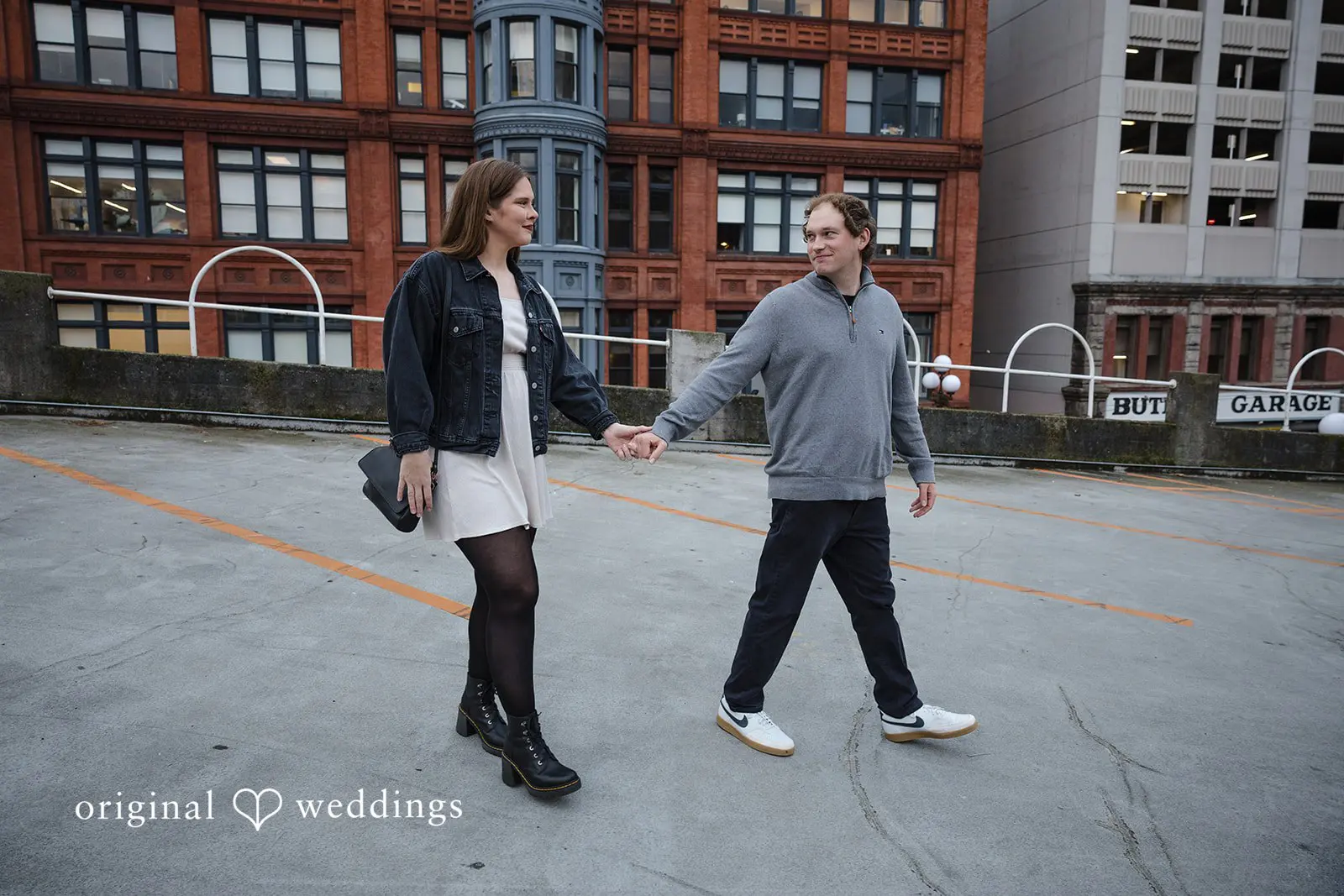 A portrait of the couple walking through Old Town Issaquah