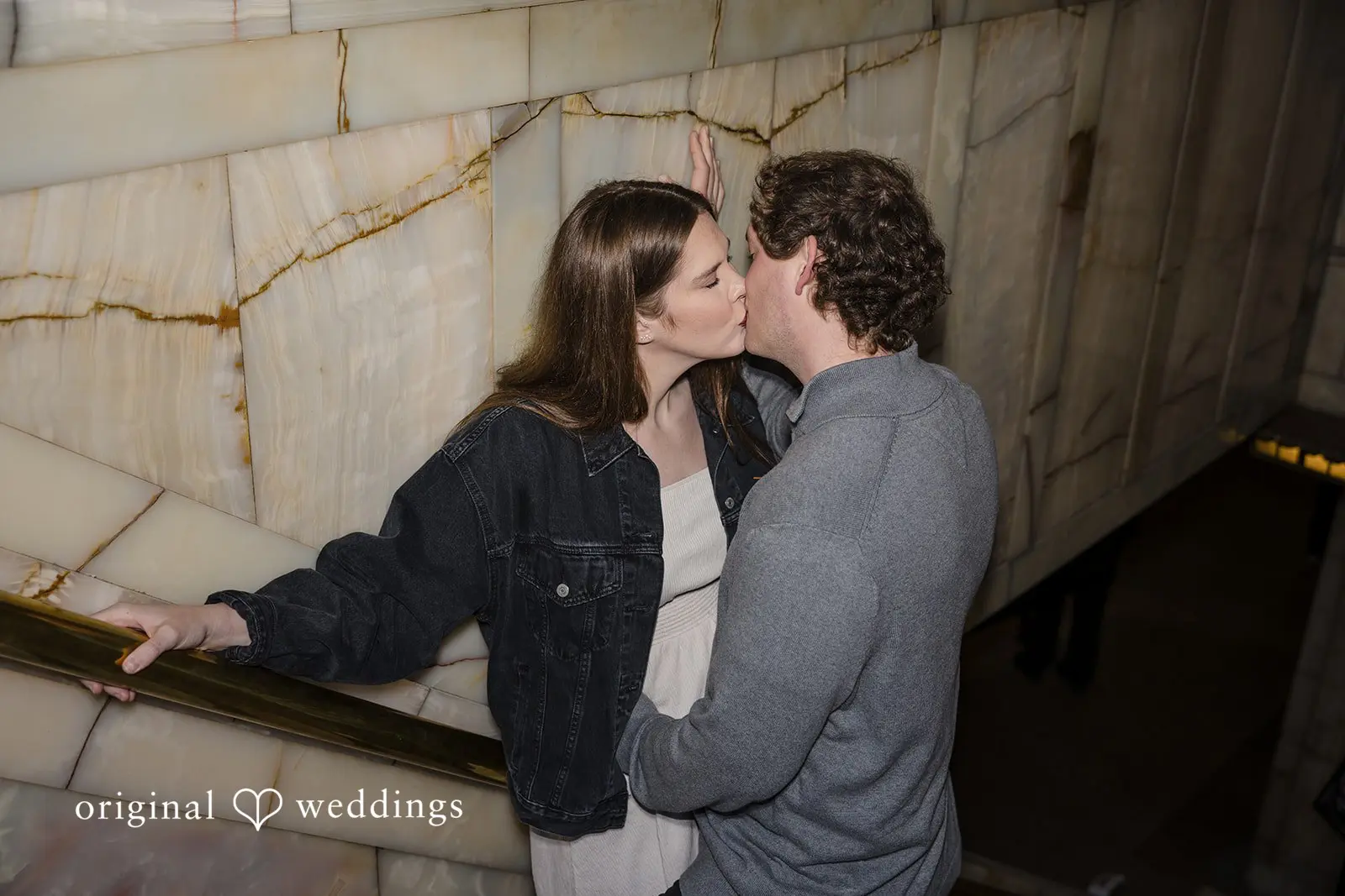 The couple shares a kiss