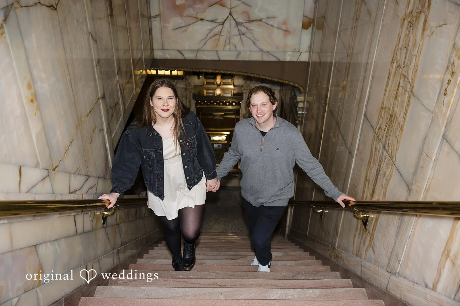 A portrait of the couple walking up the stairs at Old Town Issaquah