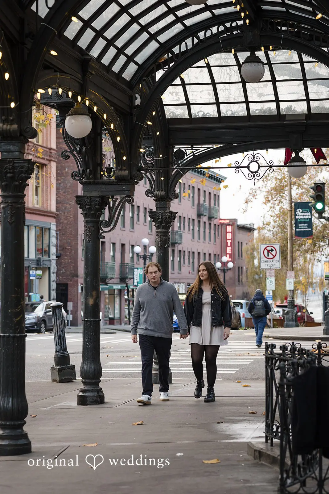 A portrait of the couple taking a walk in Old Town Issaquah