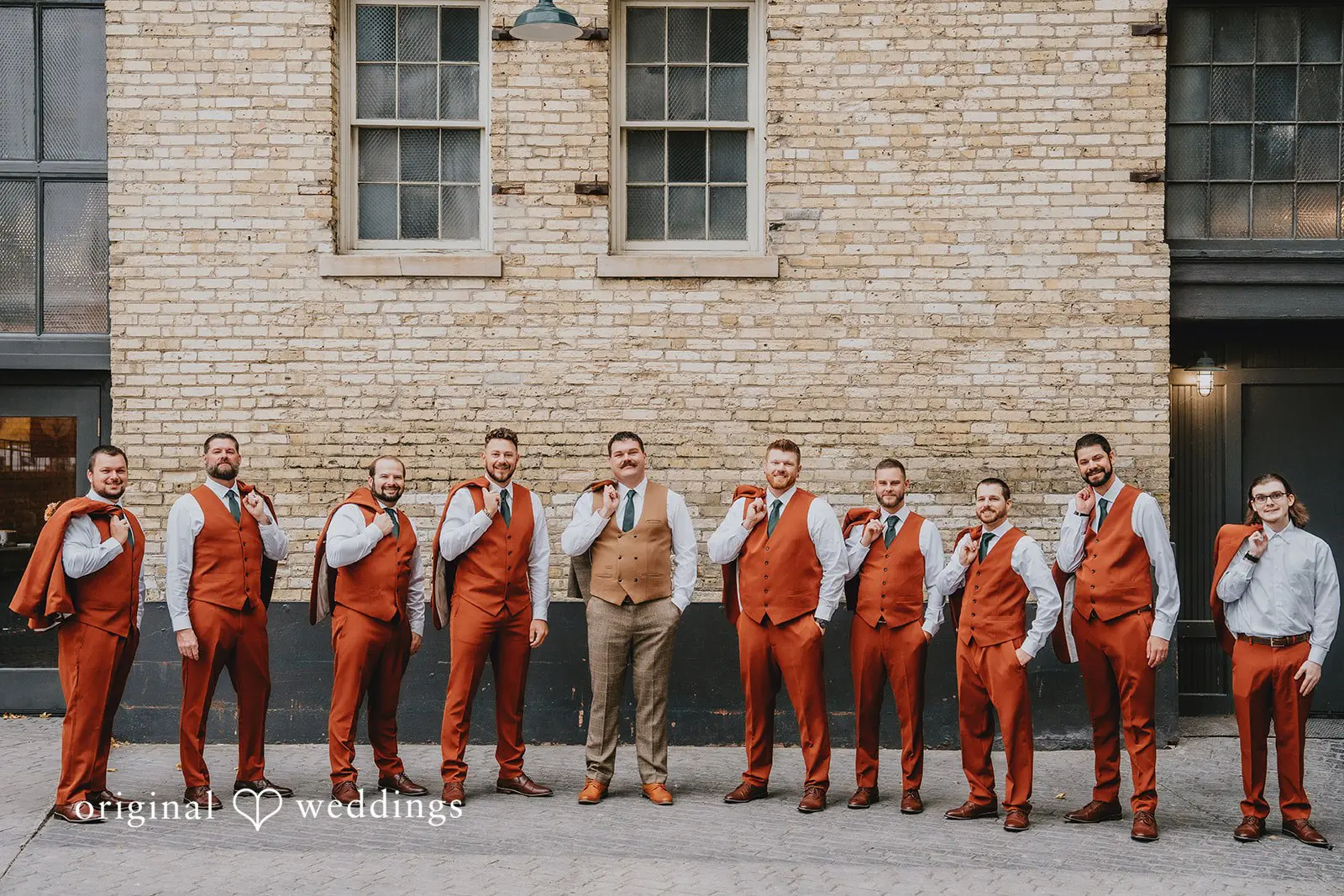 Hayden + Abby Vibrant portrait of groom and groomsmen at the outdoor space of Pritzlaff Events
