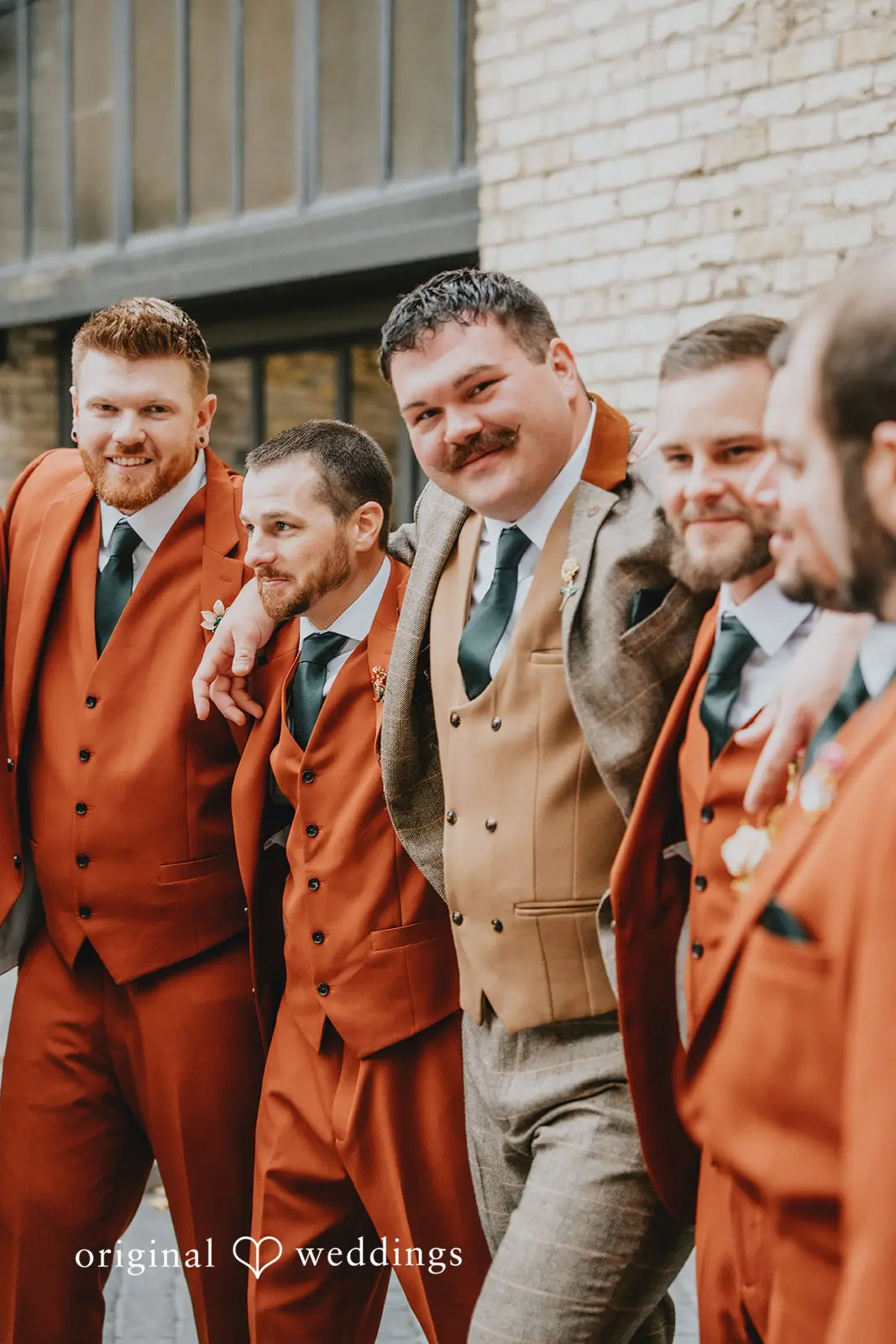 Hayden + Abby The groom and groomsmen looking all happy at Pritzlaff Events