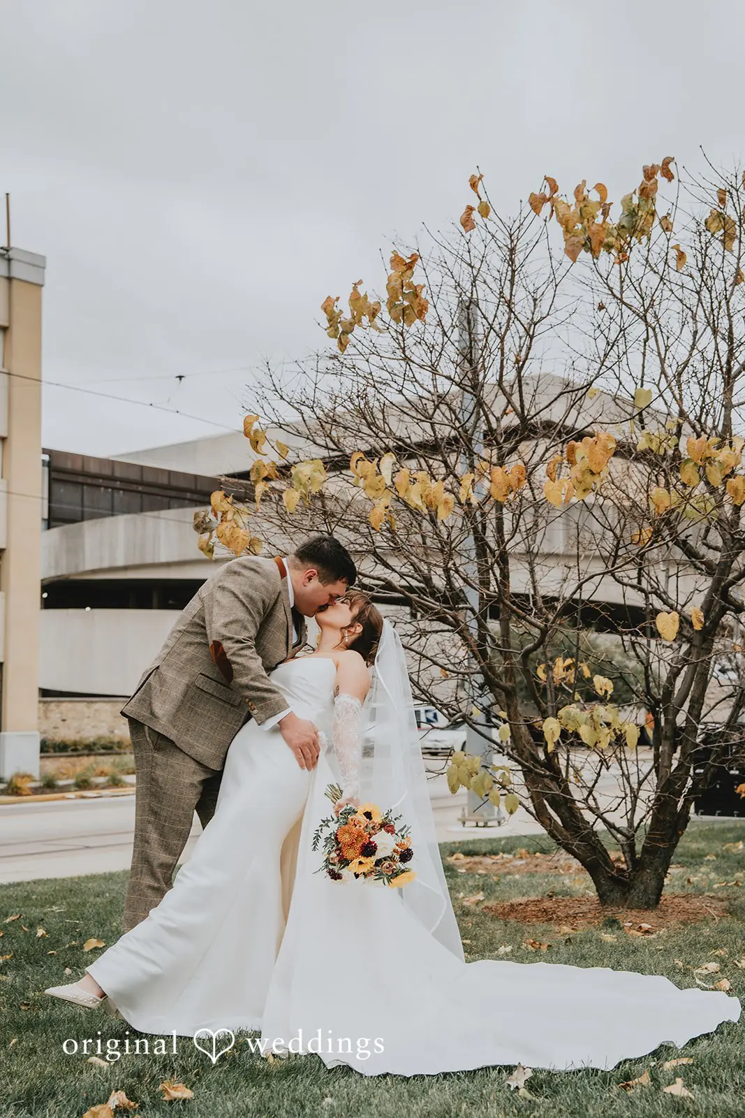 Hayden + Abby The couple shares a romantic kiss at Pritzlaff Events' garden