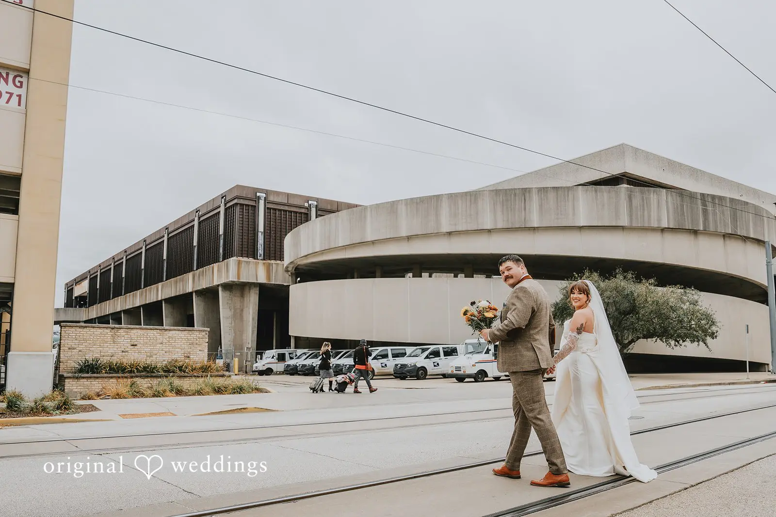 Hayden + Abby Bride and groom taking a walk in the outdoor space of Pritzlaff Events