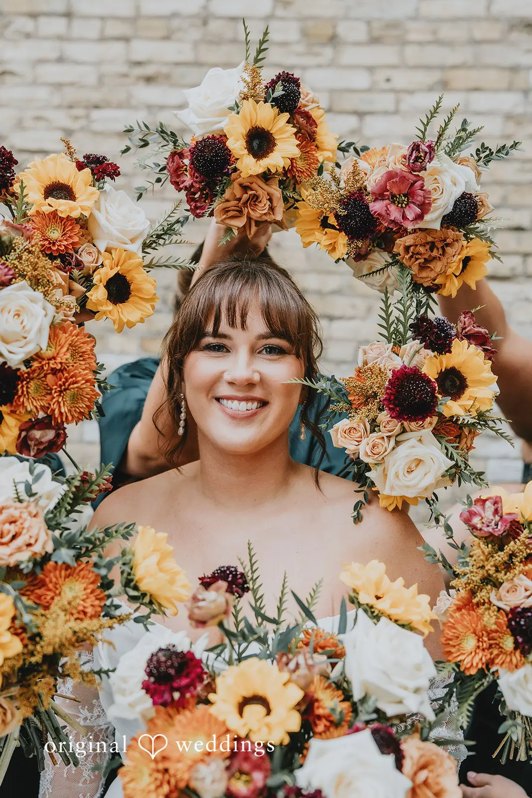 Hayden + Abby A beautiful portrait of the bride rounded with vibrant blooms