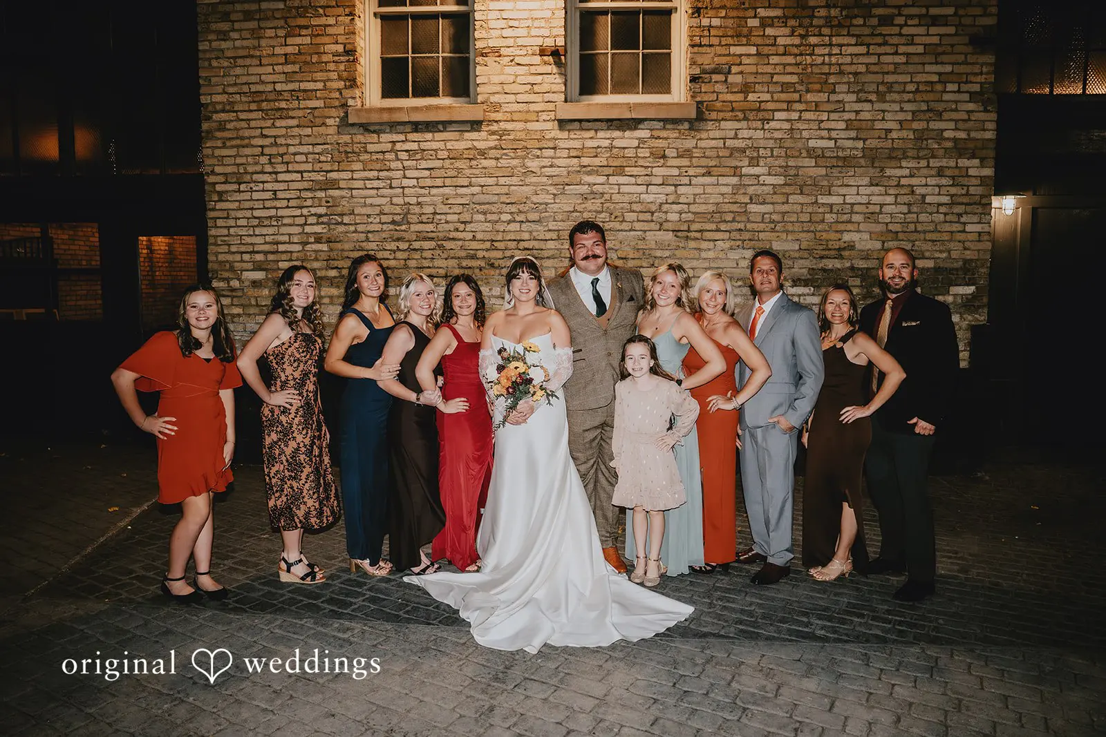 Hayden + Abby Bride and groom with family after the wedding ceremony at Pritzlaff Events