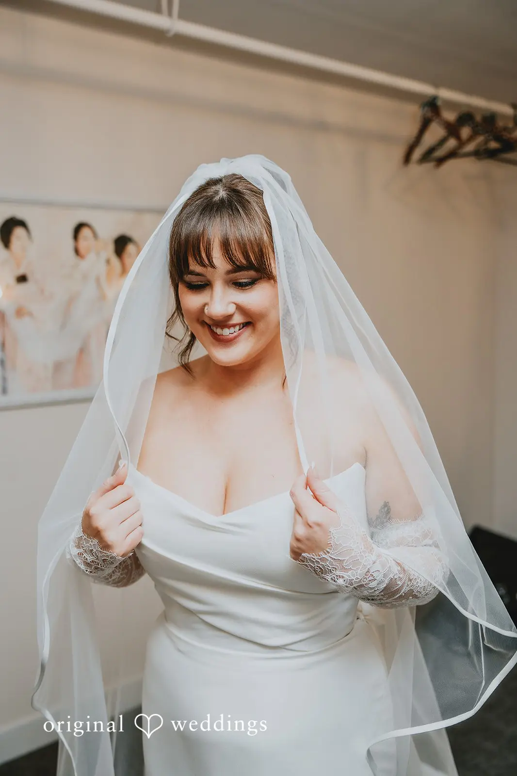 Hayden + Abby A happy moment of the bride on her veil before the ceremony