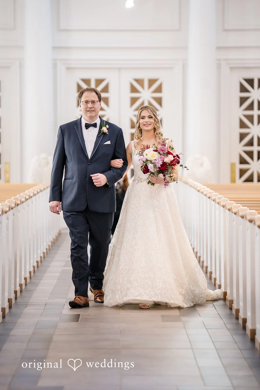 Bride's father escorts Bride down the aisle