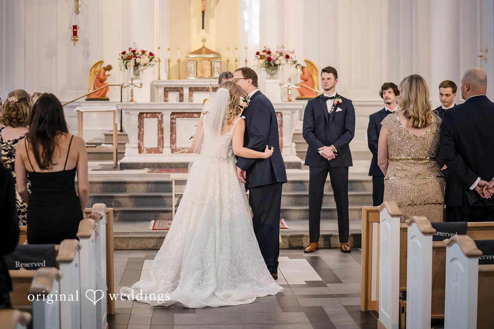 The bride and groom seal their union with a kiss