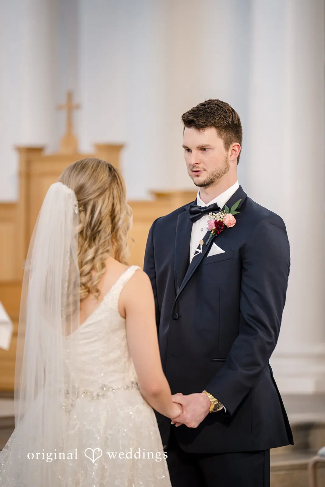 The bride and groom at the altar and about to exchange marital vows