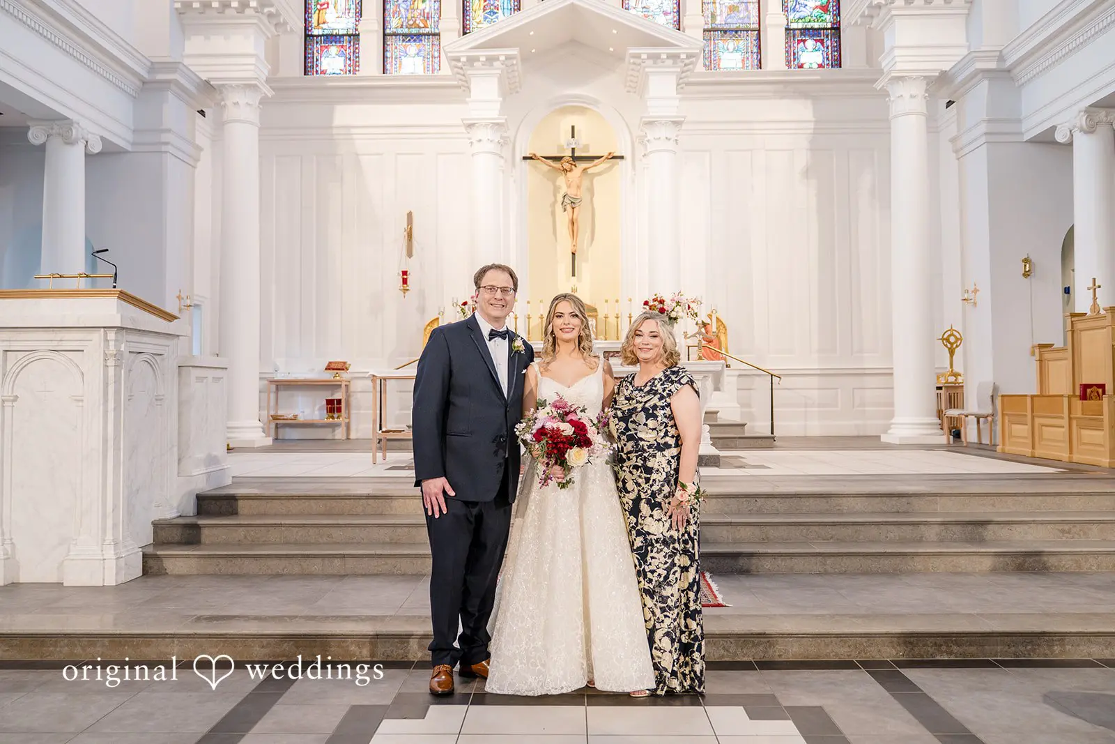 A portrait of the bride with her parents