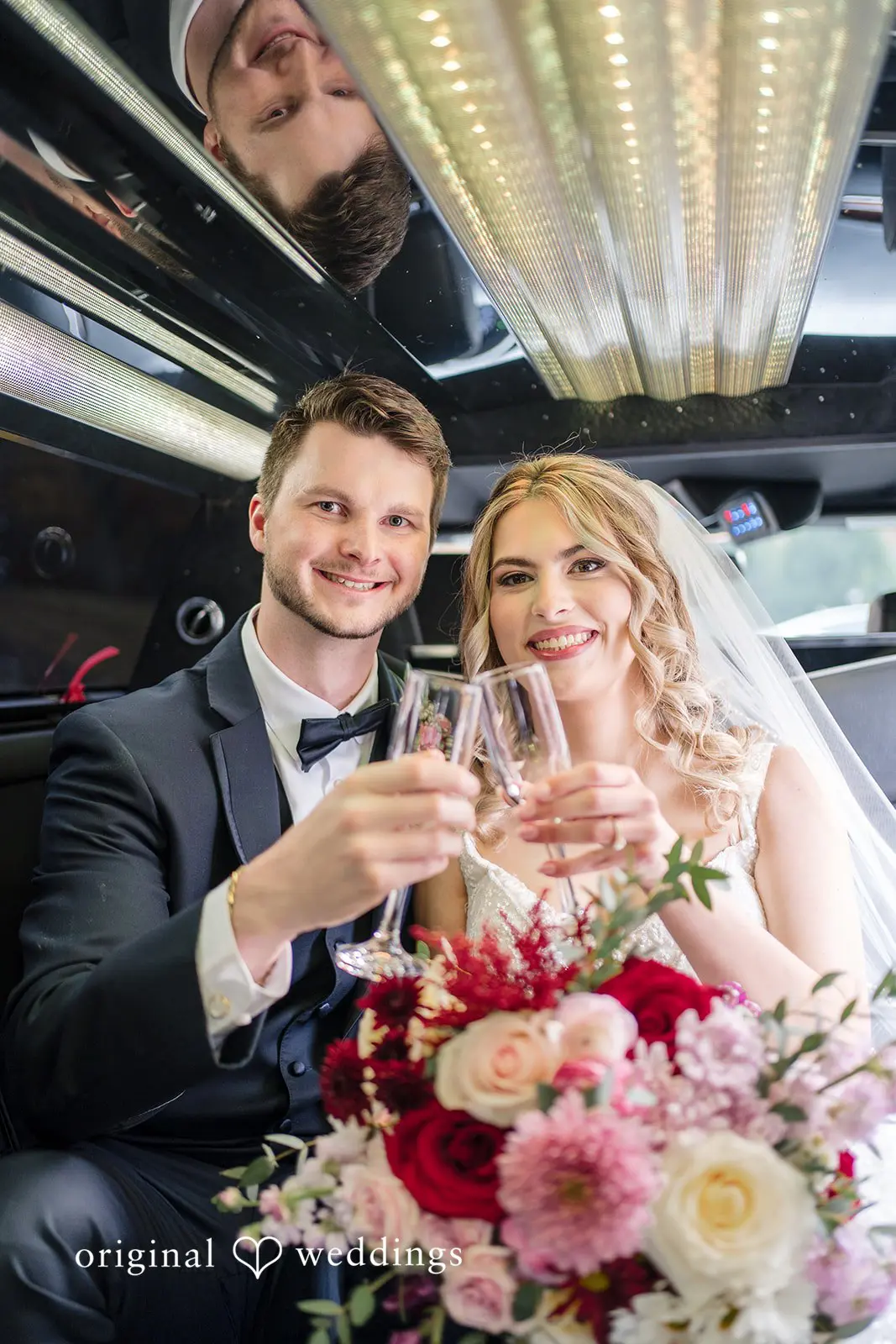 Happy bride and groom in their sleek car after their wedding ceremony