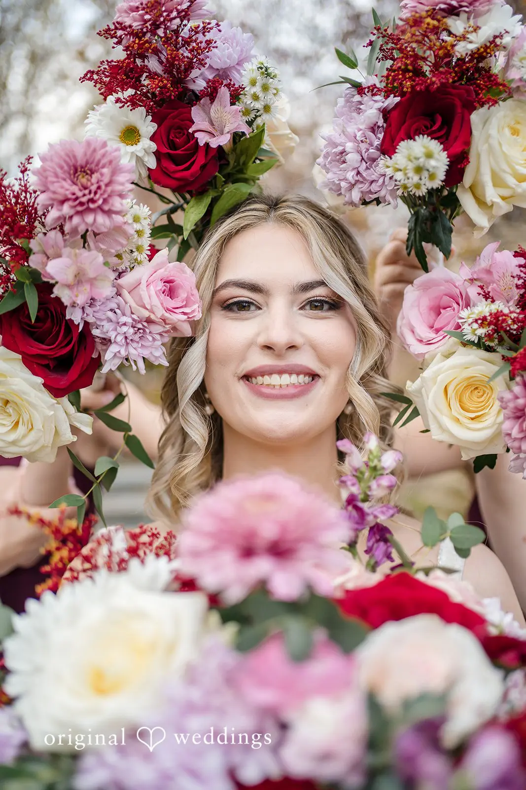 A stunning portrait of the bride with vibrant blooms