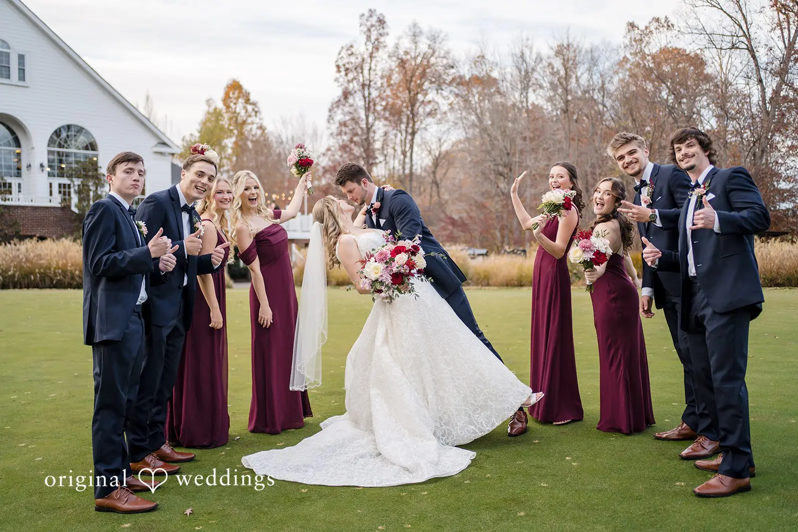 A romantic portrait of the couple with their bridal party at the Saint Mary of Sorrows Catholic Church