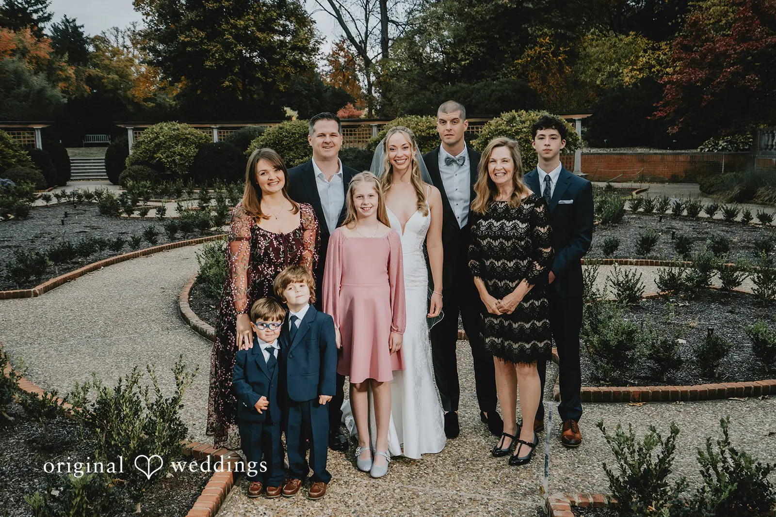 A portrait of the couple with family at St. Louis Botanical Gardens