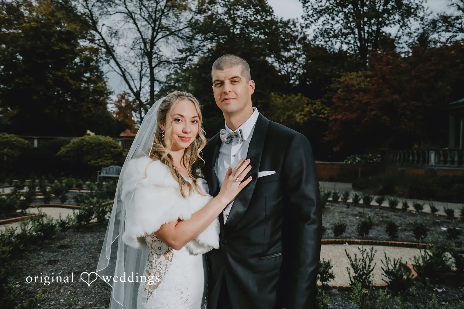 A portrait of the bride and groom at the beautiful outdoor space of St. Louis Botanical Gardens