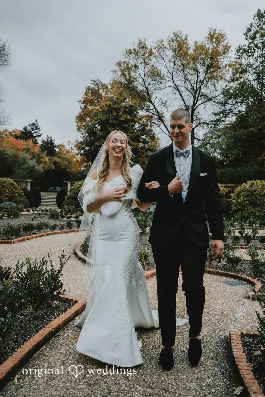 A joyful portrait of the bride and groom at St. Louis Botanical Gardens