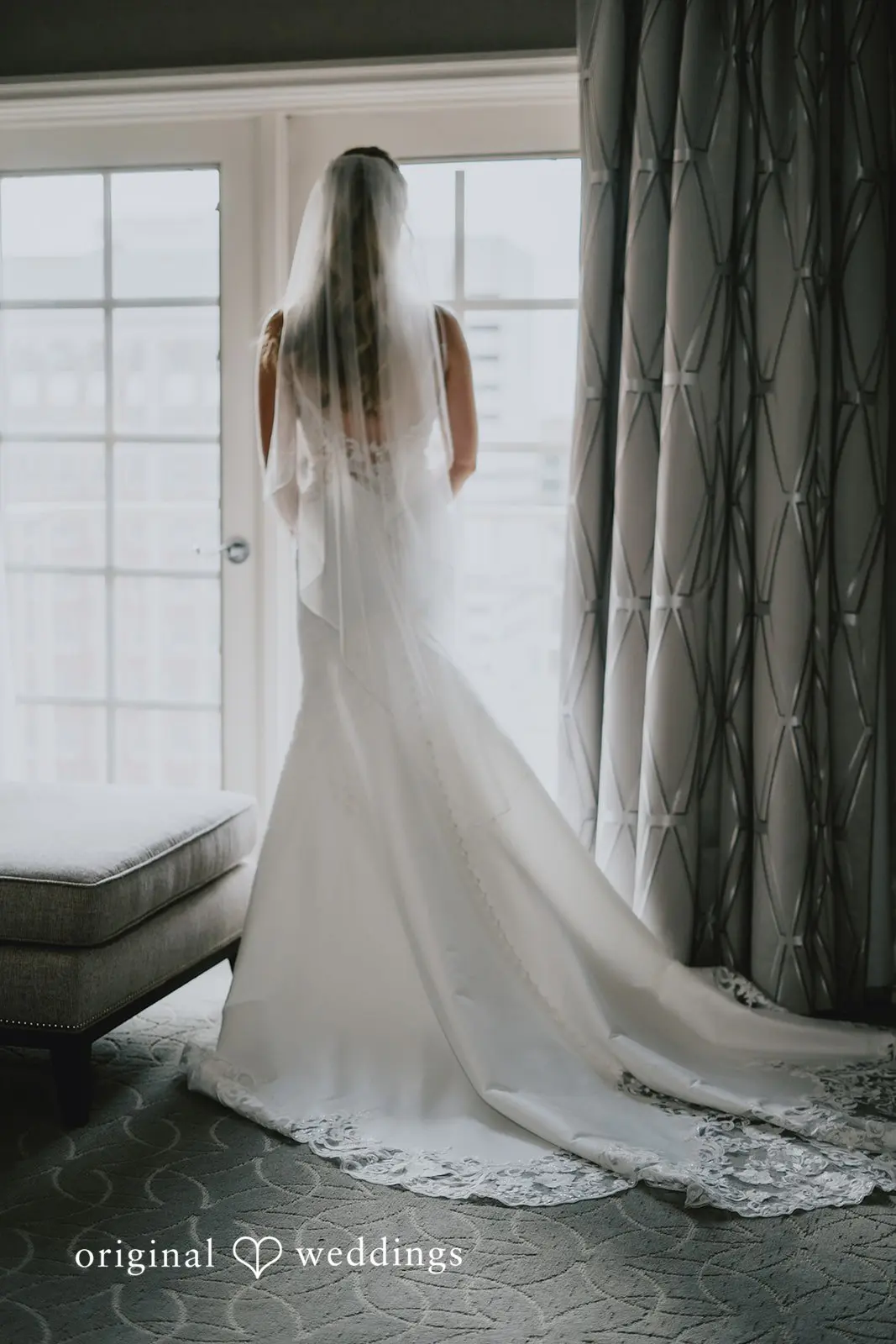 A back-view portrait of the bride before the wedding ceremony