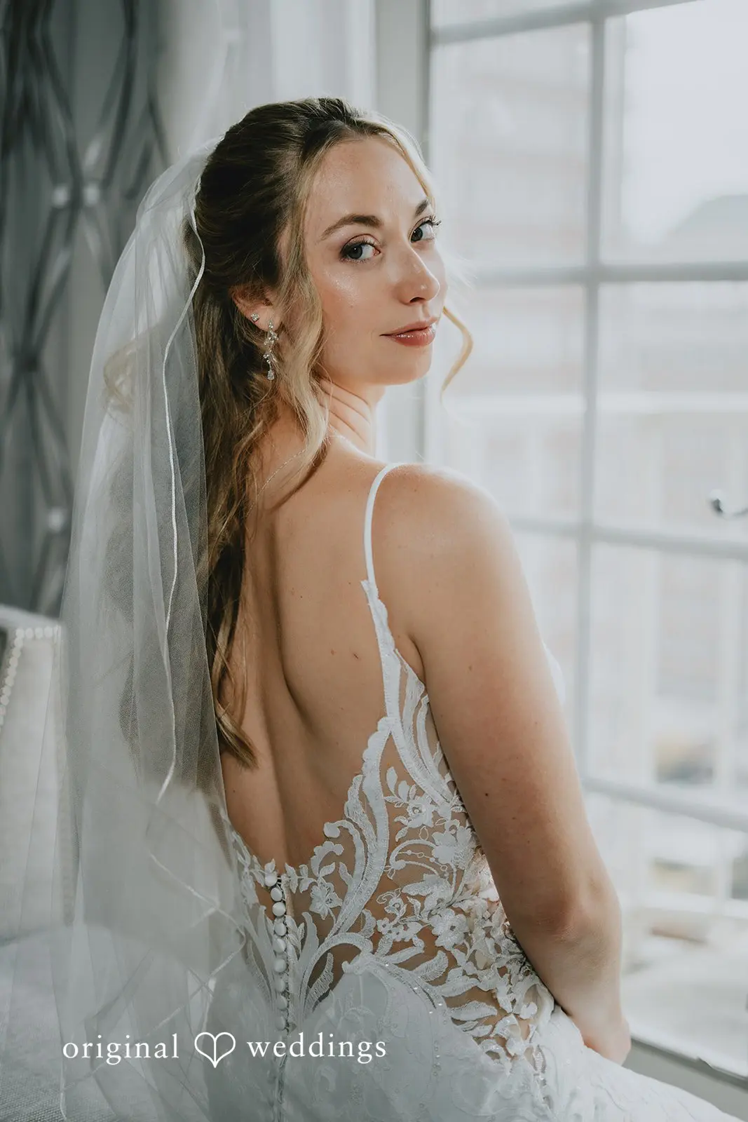 A stunning side-view portrait of the bride before the wedding ceremony
