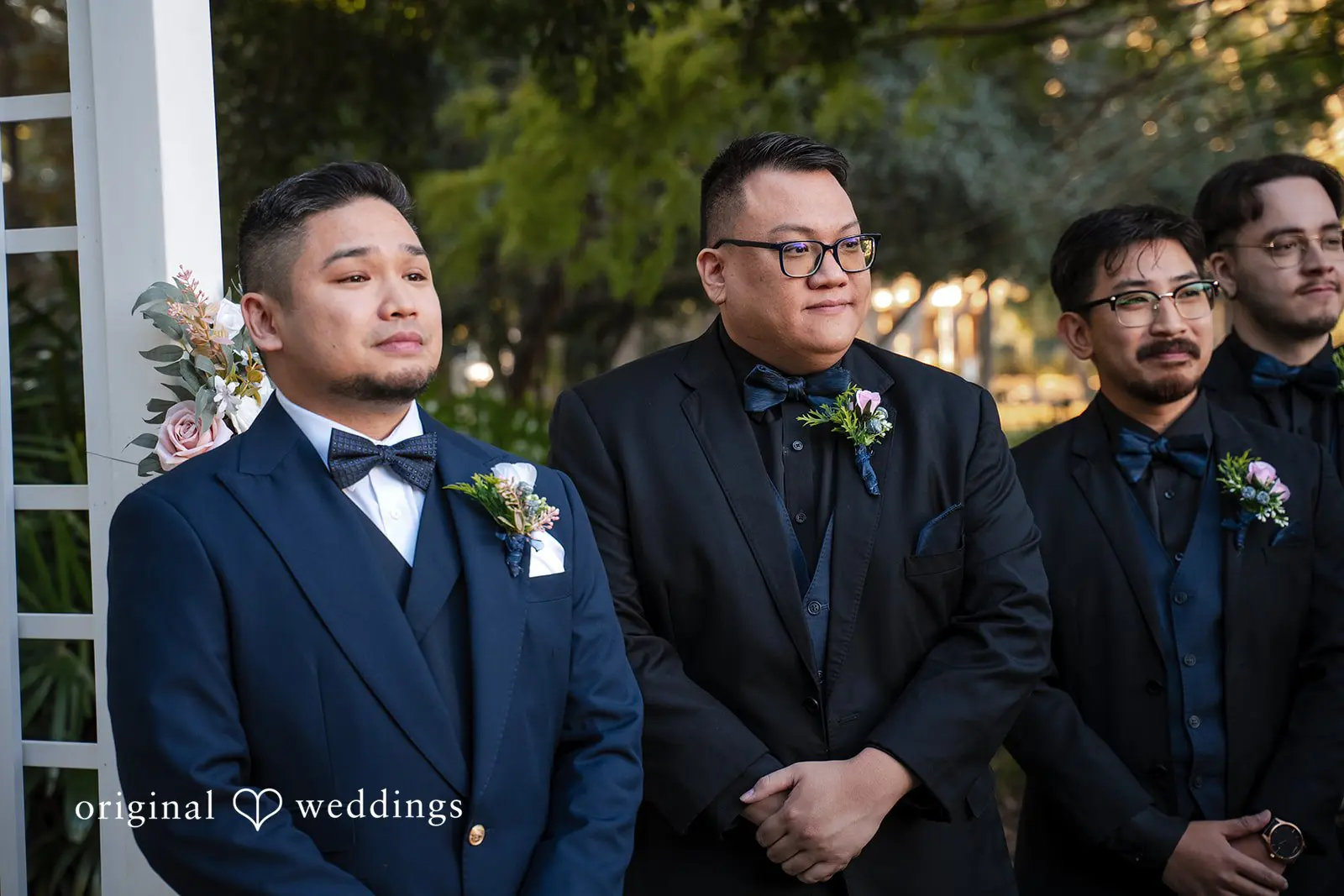 Groom waiting with his groomsmen at the altar during the outdoor ceremony at Tampa Garden Club