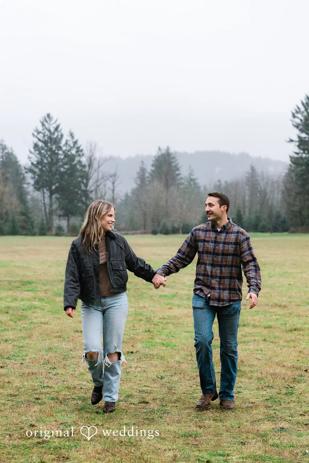 A portrait of the couple holding hands as they walked through the field