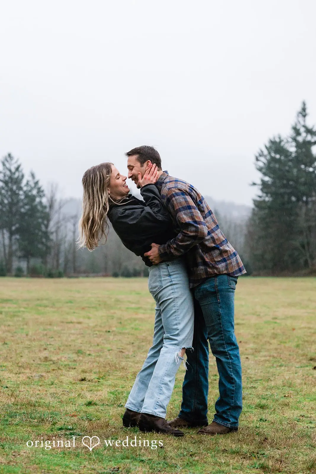 A romantic portrait of the couple in the field