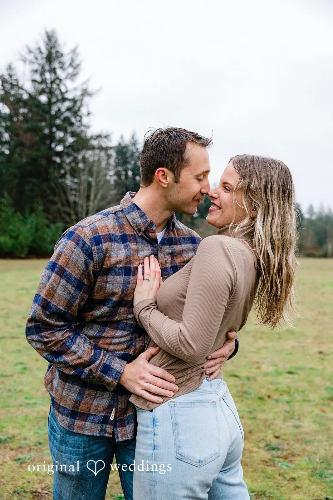 A romantic portrait of the couple in the field at Tanner Landing Park