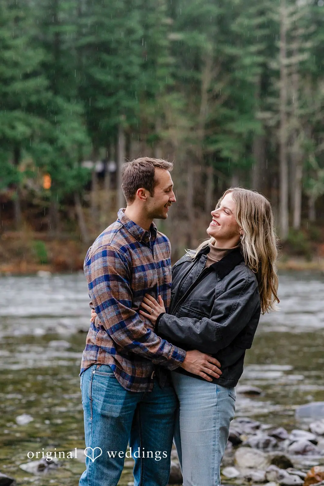 A romantic portrait of the couple at the riverbank