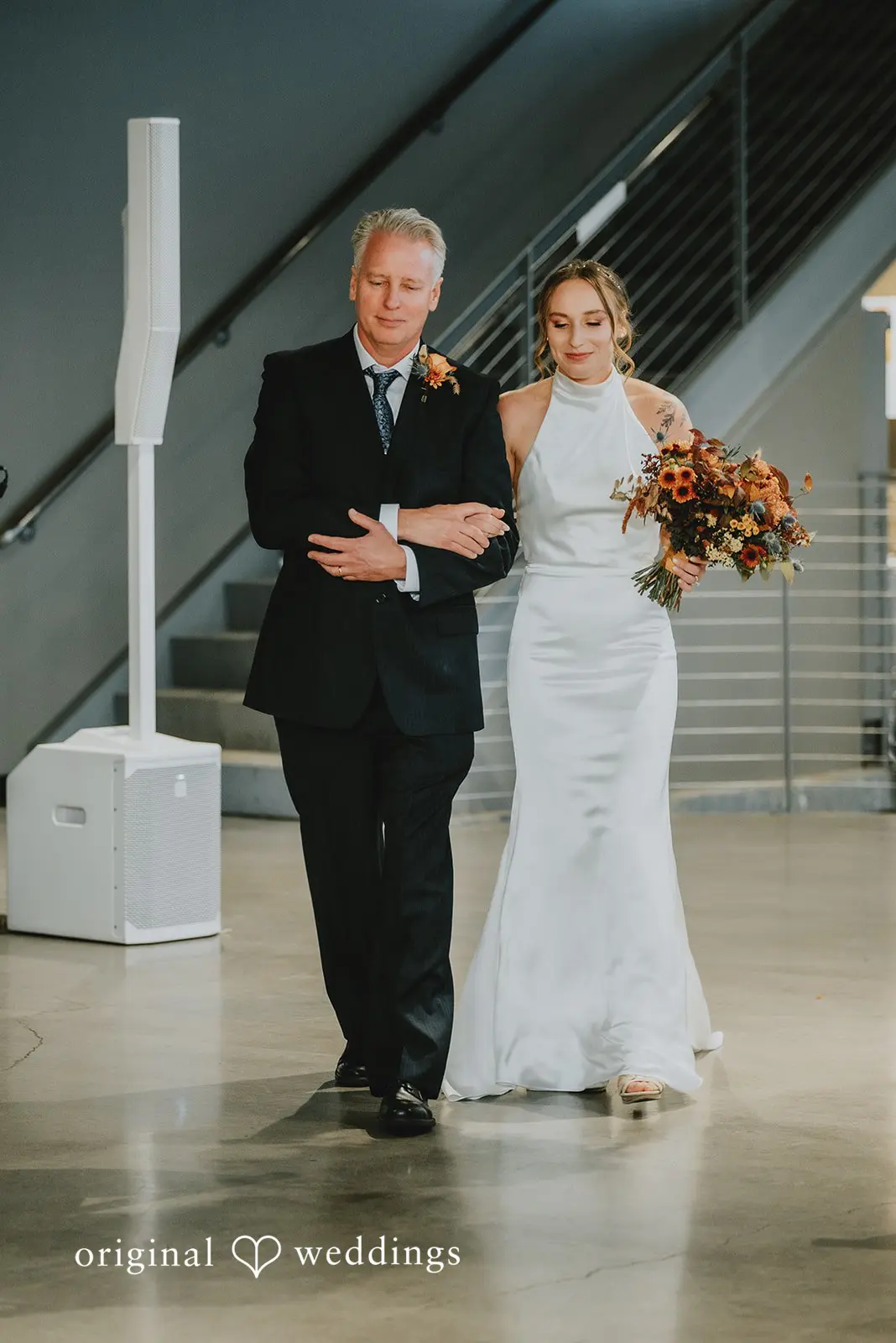Bride's father escorts the bride down the aisle at The Black Pearl wedding ceremony