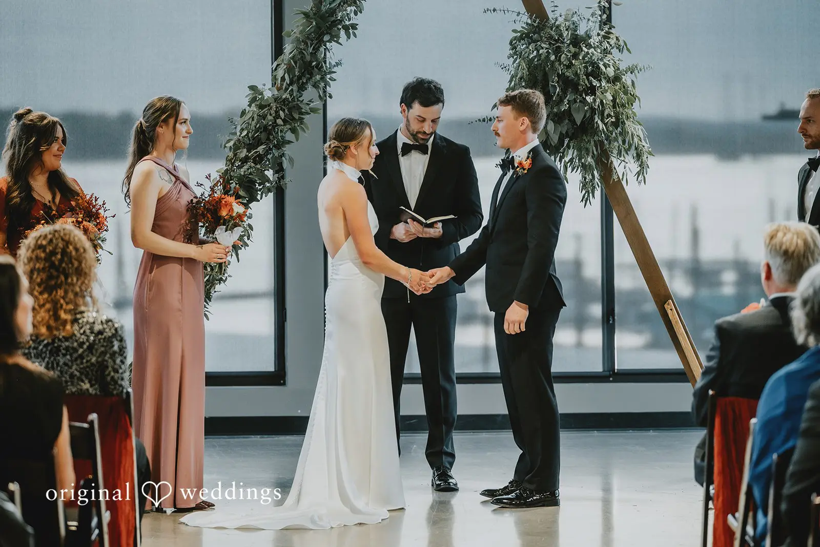 A close shot of the bride and groom about to exchange marital vows