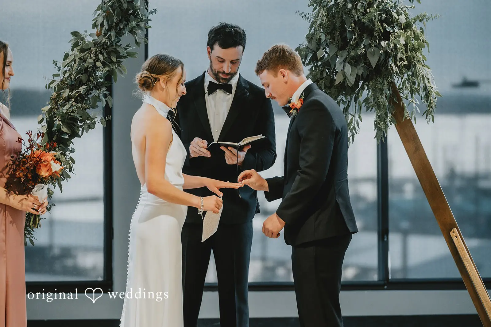 The bride and groom exchange rings