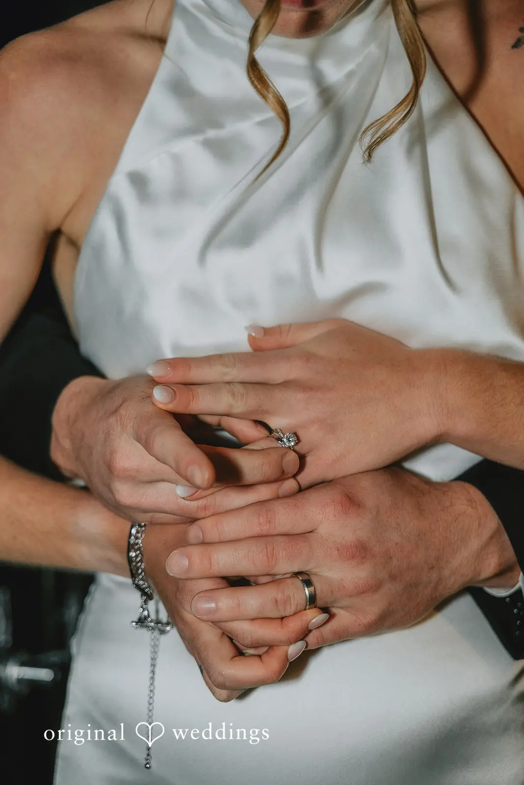 A close-up shot of the bride and groom's wedding ring