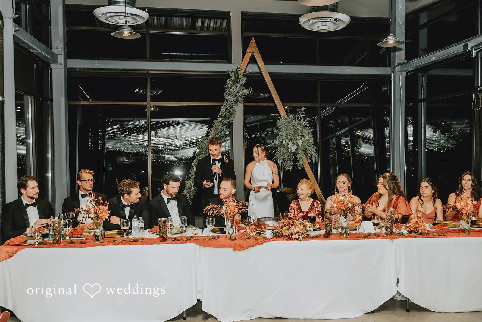 The couple and the bridal party at the wedding reception