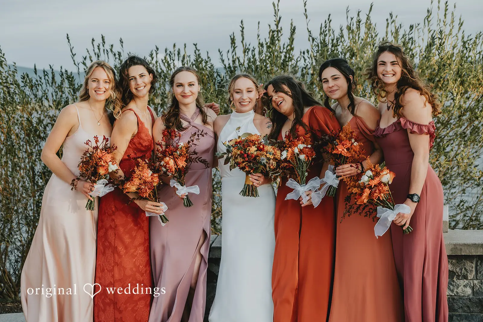 A portrait of the bride with her bridesmaids