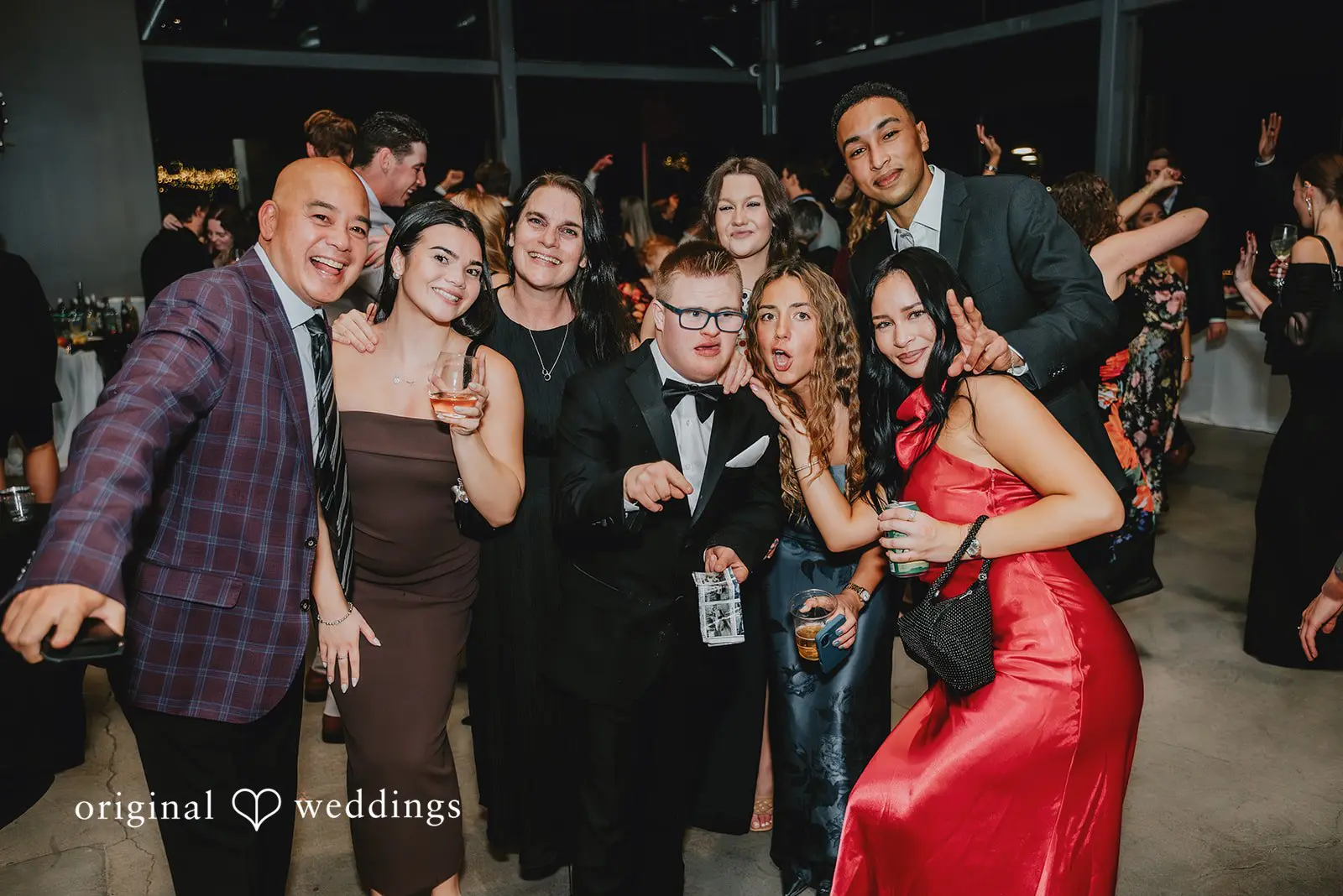 A portrait of the wedding guests at the wedding reception
