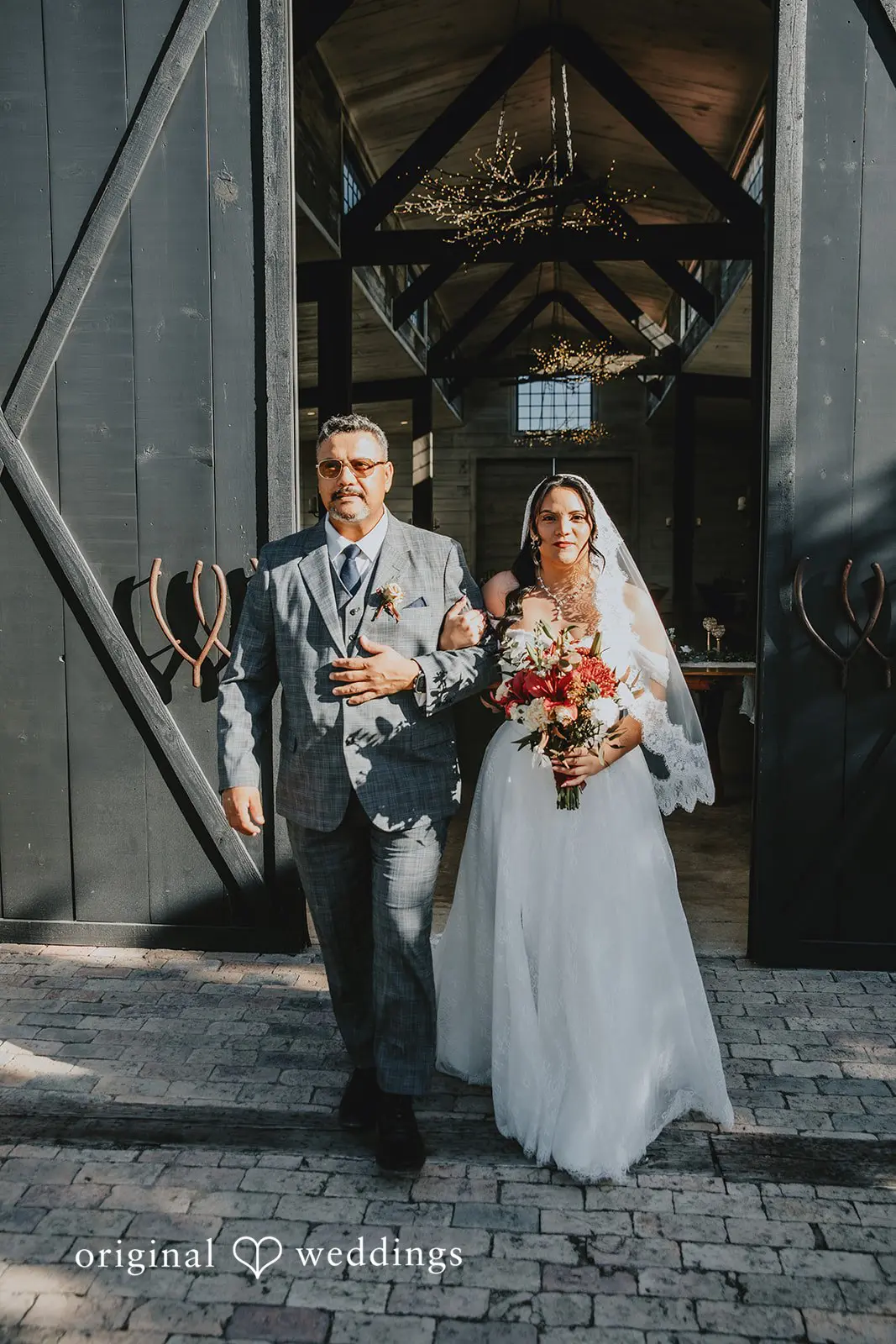 Bride's father escorts Bride down the aisle