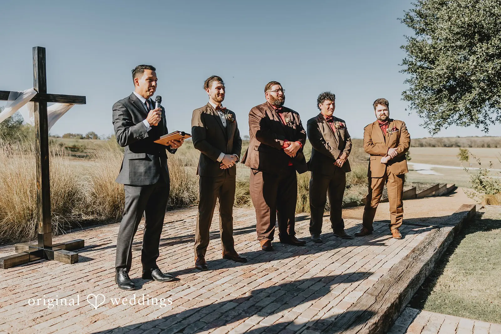 The groom and groomsmen in anticipation of the bride
