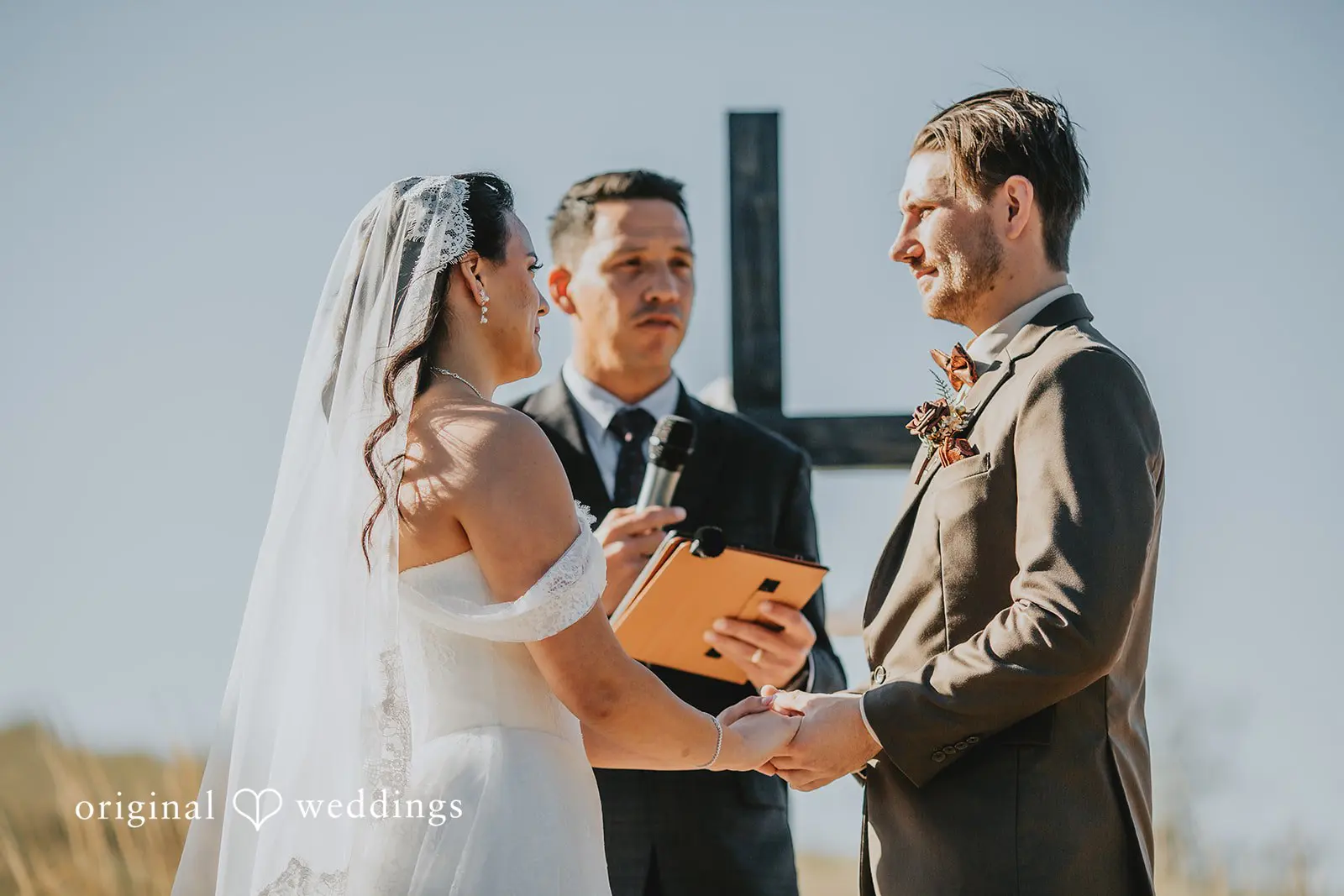 The bride and groom exchange marital vows at Two Wishes Ranch