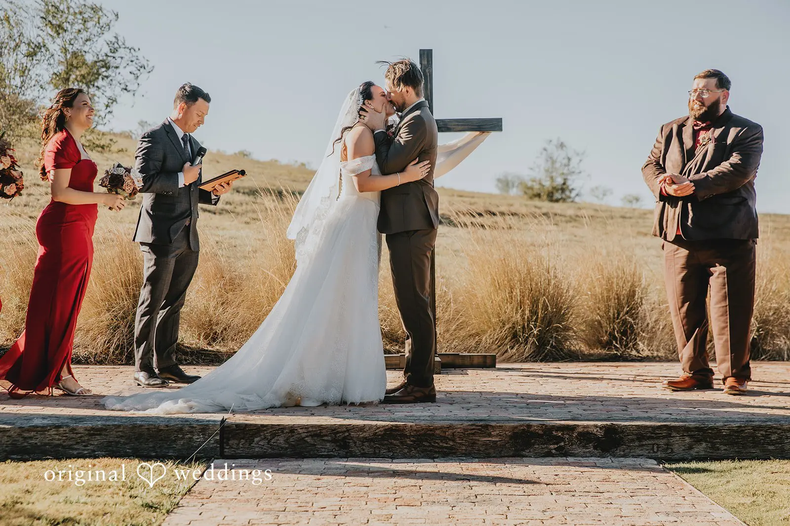 The bride and groom's first kiss at Two Wishes Ranch