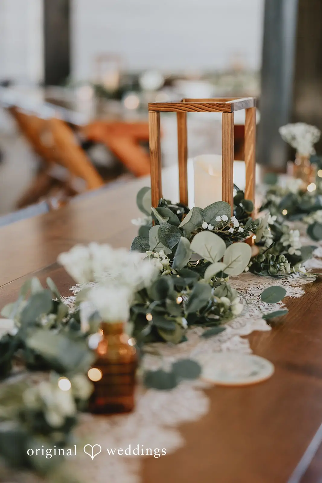 A detail shot of the reception table adorned with fresh florals